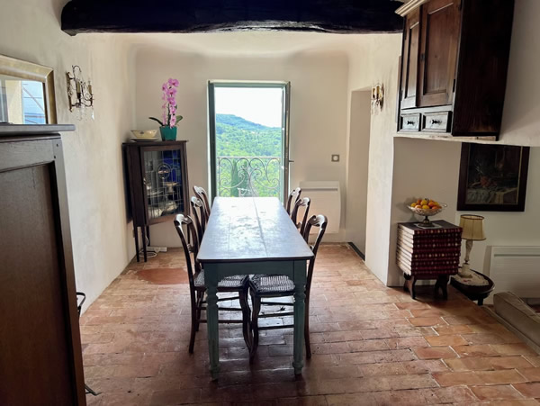 Alongside the kitchen is the dining table, that seats six to eight. The views of the lavender fields from the dining room leave you breathless.