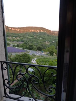 Sit in the window seat of the dining room and enjoy the views of lavender fields and the town of Apt.